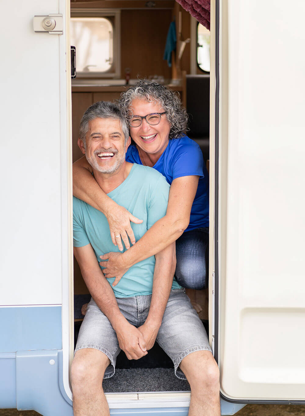 older couple with gray hair in motor home