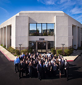 All the Pinney Insurance employees standing in front of the office building