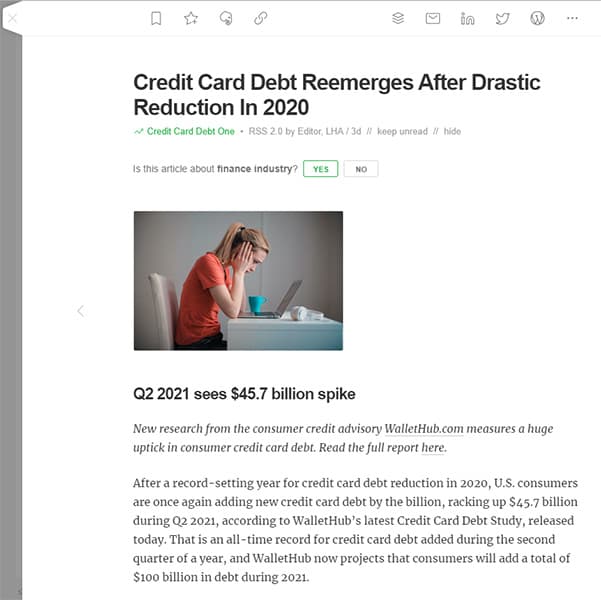 Screenshot of an article about increasing credit card debt visible in the Feedly reader