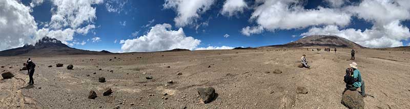 Mark Acre in front of the sign on top of Mount Kilimanjaro