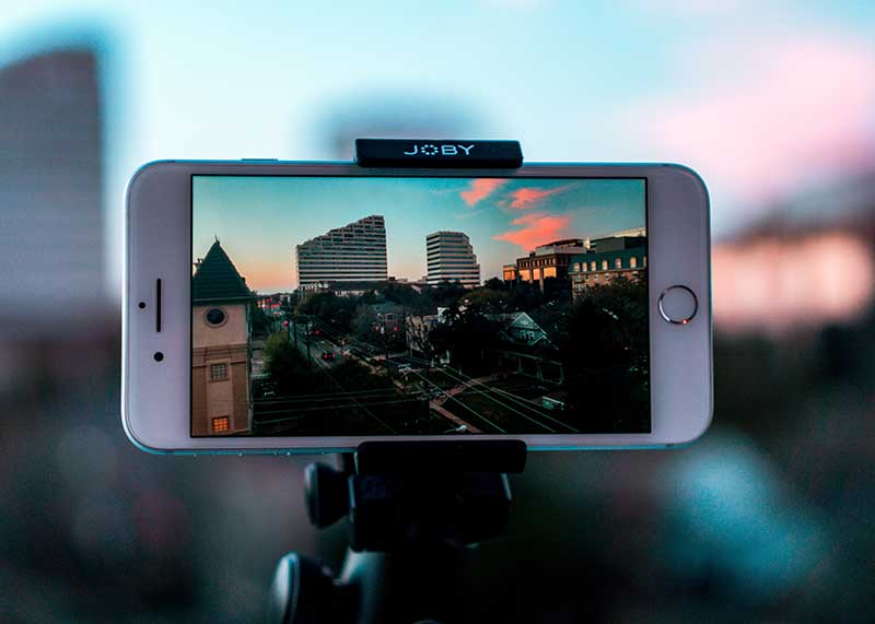 Screenshot of an iPhone and tripod set up to do an easy cell phone video.