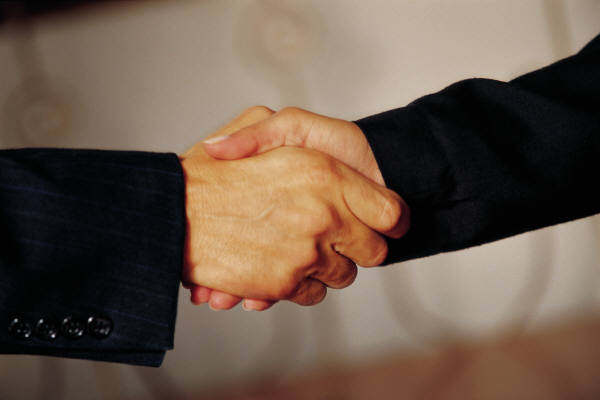 Businesspeople shaking hands.