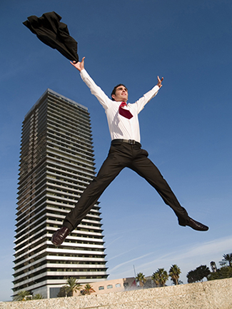 Businessman jumping for joy.